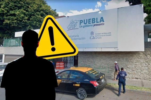 Sombra con fachada de la Comisión de Búsqueda de Personas al fondo  
