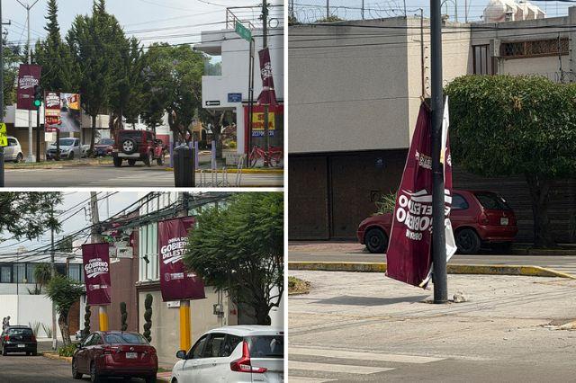 Lonas colgadas en la calle anunciando obras del gobierno de Puebla 