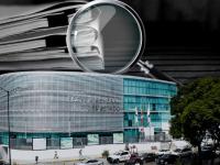 Fachada de la FGE Puebla con documentos y lupa 