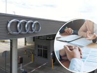 Fachada de Audi Puebla con imagen de persona firmando contrato a un lado 